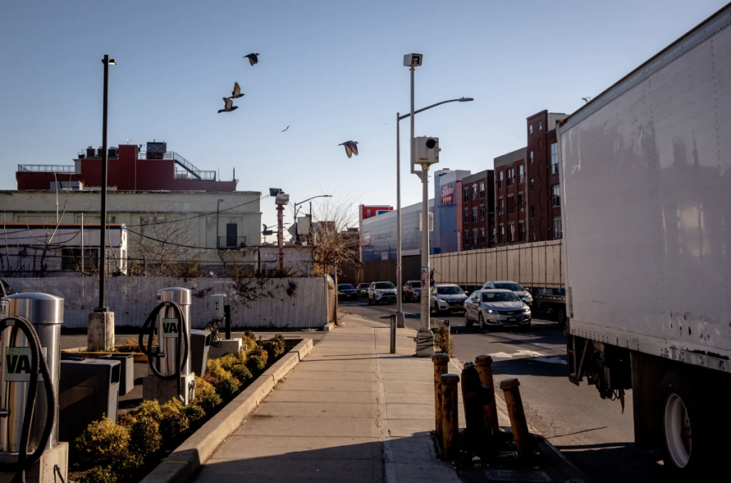 Street view of Atlantic Avenue with sidewalk and card driving lanes.